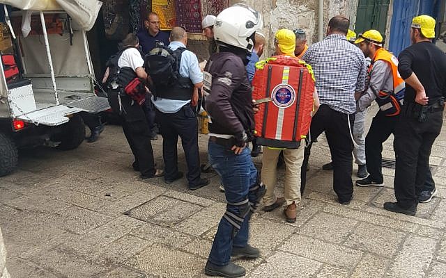 Medics tend to an Israeli victim of a stabbing attack in the Old City of Jerusalem on March 18, 2018. (Ir Amim)