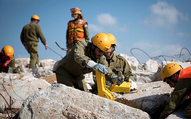 Soldiers from the IDF's Homefront Command perform search and rescue exercises during a nationwide, week-long, emergency preparedness drill in March 2018. (Israel Defense Forces) Soldiers from the IDF's Homefront Command perform search and rescue exercises during a nationwide, week-long, emergency preparedness drill in March 2018. (Israel Defense Forces)