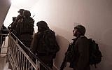 IDF troops prepare the home of Palestinian terrorist Abd al-Rahman Bani Fadel for demolition in the northern West Bank village of Aqraba on March 19, 2018. (Israel Defense Forces)