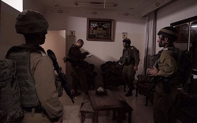 IDF troops prepare the home of Palestinian terrorist Abd al-Rahman Bani Fadel for demolition in the northern West Bank village of Aqraba on March 19, 2018. (Israel Defense Forces) IDF troops prepare the home of Palestinian terrorist Abd al-Rahman Bani Fadel for demolition in the northern West Bank village of Aqraba on March 19, 2018. (Israel Defense Forces)