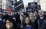Members of the Jewish community hold a protest against Britain's opposition Labour Party leader Jeremy Corbyn and anti-Semitism in the  Labour party, outside the British Houses of Parliament in central London on March 26, 2018. (AFP/Tolga Akmen)