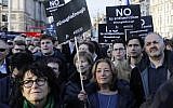Members of the Jewish community hold a protest against Britain's opposition Labour party leader Jeremy Corbyn and anti-Semitism in the Labour Party, outside the British Houses of Parliament in central London, on March 26, 2018. (AFP Photo/Tolga Akmen)
