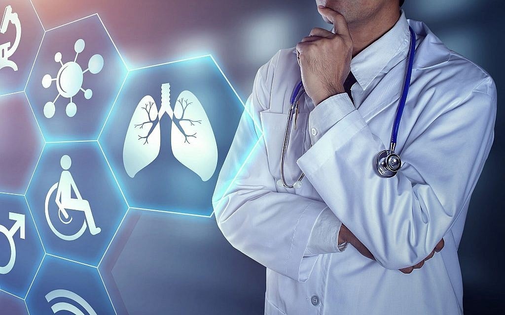 Illustrative image of a doctor with digital icons (chaiyapruek2520, iStock by Getty Images)