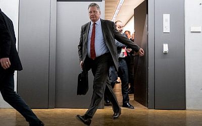President of the German Federal Intelligence Agency (BND) Bruno Kahl (L) leaves after a meeting with members of the Parliamentary Control Panel (PKGr) at the parliament in Berlin after Russian hackers infiltrated Germany's foreign and interior ministries' online networks, March 1, 2018. (AFP PHOTO / DPA / Kay Nietfeld / Germany OUT)