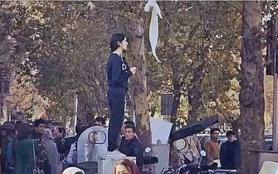 The iconic 'Girl of Enghelab Street,' Vida Movahed, who appeared in public in Tehran, Iran, in December 2017 without wearing a headscarf, as mandated by law. (YouTube screenshot)