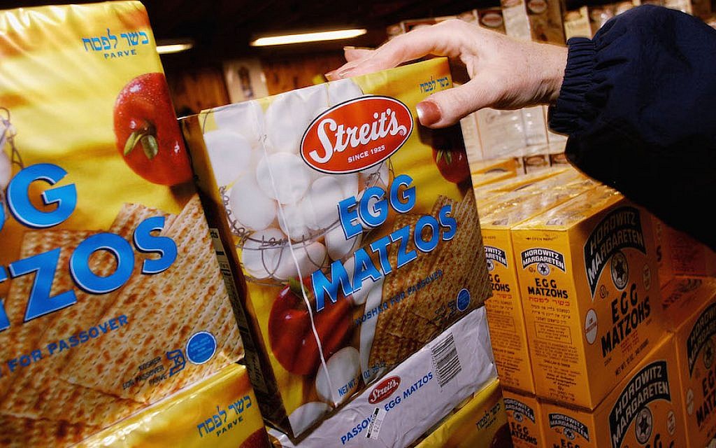 An illustrative photo of a shopper at a grocery store picking up a box of matzah. (William Thomas Cain/Getty Images/via JTA) An illustrative photo of a shopper at a grocery store picking up a box of matzah. (William Thomas Cain/Getty Images/via JTA)