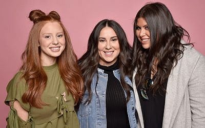 From left to right: Jackie Oshry, Claudia Oshry and Olivia Oshry at the Beautycon Festival in New York, May 20, 2017. Their sister Margo, not pictured, runs a food-focused Instagram account. (Kris Connor/Getty Images for Beautycon via JTA)