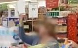 A woman who identified herself only as Varda filmed heaping racial abuse on a young man of Ethiopian origin as other customers in the supermarket kept silent, March 2018. (YouTube screenshot)