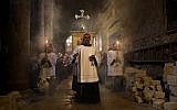 Franciscan friars pray during the Lenten procession inside the Church of the Holy Sepulchre in the Old City of Jerusalem, on February 17, 2018. (AFP PHOTO / Thomas COEX)