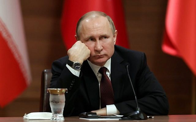 Russia's President Vladimir Putin attends a joint press conference with the leaders of Turkey and Iran as part of a tripartite summit on Syria, in Ankara, on April 4, 2018. (AFP/Adem Altan) Russia's President Vladimir Putin attends a joint press conference with the leaders of Turkey and Iran as part of a tripartite summit on Syria, in Ankara, on April 4, 2018. (AFP/Adem Altan)
