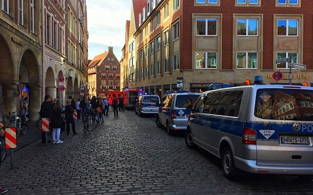 First responders work at the scene where several people were killed and injured when a car plowed into pedestrians in Munster, western Germany on April 7, 2018. (AFP PHOTO / dpa)