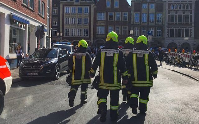 First responders work at the scene where several people were killed and injured when a car plowed into pedestrians in Munster, western Germany on April 7, 2018. (AFP PHOTO / dpa)