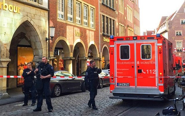 Police and first responders work at the scene where several people were killed and injured when a car plowed into pedestrians in Munster, western Germany on April 7, 2018. (AFP PHOTO / dpa)