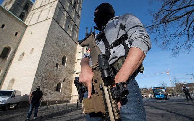 Special police officers are seen near the scene where several people were killed and injured when a car plowed into pedestrians in Munster, western Germany on April 7, 2018. (AFP PHOTO / dpa / Bernd Thissen)