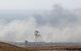 Smoke billows in the town of Douma, the last opposition holdout in Syria's Eastern Ghouta, on April 7, 2018, after Syrian regime troops resumed a military blitz to pressure rebels to withdraw. (AFP PHOTO / STRINGER)
