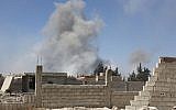 Smoke billows in the town of Douma, the last opposition holdout in Syria's Eastern Ghouta, on April 7, 2018. (AFP)