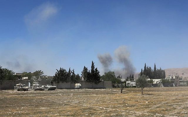 Smoke billows in the town of Douma, the last opposition holdout in Syria's Eastern Ghouta, on April 7, 2018. (AFP) Smoke billows in the town of Douma, the last opposition holdout in Syria's Eastern Ghouta, on April 7, 2018. (AFP)