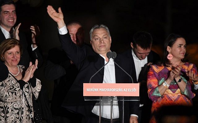Hungarian Prime Minister Viktor Orban and members of his FIDESZ party celebrate from the podium on the bank of the Danube River after winning the parliamentary election on April 8, 2018 in Budapest. (AFP PHOTO/ATTILA KISBENEDEK) Hungarian Prime Minister Viktor Orban and members of his FIDESZ party celebrate from the podium on the bank of the Danube River after winning the parliamentary election on April 8, 2018 in Budapest. (AFP PHOTO/ATTILA KISBENEDEK)
