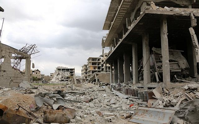Illustrative: Destruction in the former rebel-held town of Saqba in the Eastern Ghouta region on the outskirts of the Syrian capital Damascus on April 10, 2018. (AFP Photo/Stringer) Illustrative: Destruction in the former rebel-held town of Saqba in the Eastern Ghouta region on the outskirts of the Syrian capital Damascus on April 10, 2018. (AFP Photo/Stringer)