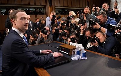 Facebook founder and CEO Mark Zuckerberg arrives to testify during a Senate Commerce, Science and Transportation Committee and Senate Judiciary Committee joint hearing about Facebook on Capitol Hill in Washington, DC, April 10, 2018. (AFP PHOTO / SAUL LOEB)