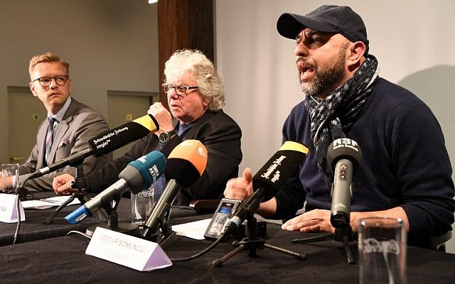 Picture taken on April 17, 2018 at the theater in Constance, southern Germany, shows director Serdar Somuncu (R) and general director Christoph Nix (C) during a press conference on a play named after Adolf Hitler's 'Mein Kampf,' written by George Tabori and staged by Somuncu. (AFP/dpa/Felix Kästle) Picture taken on April 17, 2018 at the theater in Constance, southern Germany, shows director Serdar Somuncu (R) and general director Christoph Nix (C) during a press conference on a play named after Adolf Hitler's 'Mein Kampf,' written by George Tabori and staged by Somuncu. (AFP/dpa/Felix Kästle)