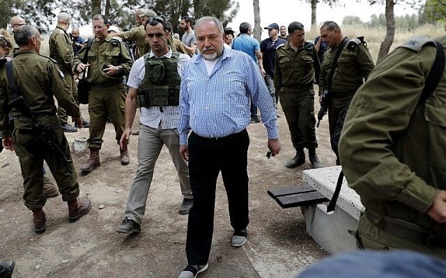 Defense Minister Avigdor Lieberman (C) leaves after a press conference in the southern kibbutz of Nahal Oz on April 20, 2018, near the Israeli border with the Gaza Strip, following his visit to Israeli troops positioned along the border with the coastal enclave during Friday clashes. (AFP Photo/Thomas Coex) Defense Minister Avigdor Lieberman (C) leaves after a press conference in the southern kibbutz of Nahal Oz on April 20, 2018, near the Israeli border with the Gaza Strip, following his visit to Israeli troops positioned along the border with the coastal enclave during Friday clashes. (AFP Photo/Thomas Coex)