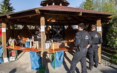 Police officers inspect the premises at the 'Schild und Schwert' (Shield and Sword) neo-Nazi festival, in the small eastern German town of Ostritz on April 20, 2018. (AFP PHOTO / John MACDOUGALL)