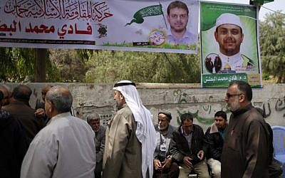 Palestinians gather in mourning outside the family home of 35-year-old professor and Hamas member Fadi Mohammad al-Batsh, who was killed early in the day in Malaysia, in Jabalia in the northern Gaza strip on April 21, 2018. (AFP PHOTO / MAHMUD HAMS)