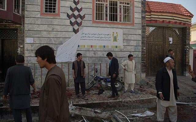 Afghan residents inspect the site of a suicide bombing outside a voter registration center in Kabul on April 22, 2018. (AFP PHOTO / SHAH MARAI) Afghan residents inspect the site of a suicide bombing outside a voter registration center in Kabul on April 22, 2018. (AFP PHOTO / SHAH MARAI)
