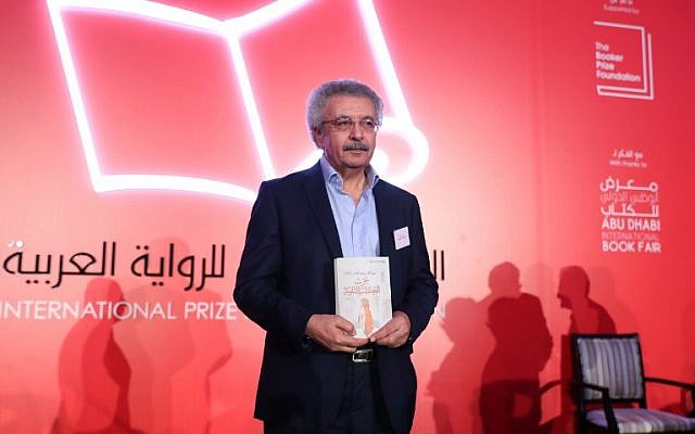 Palestinian writer Ibrahim Nasrallah poses for a photo after winning the 2018 International Prize for Arabic Fiction for his book titled "The Second war of the Dog" in Abu Dhabi on April 24, 2018 (Karim Sahib/AFP Photo) Palestinian writer Ibrahim Nasrallah poses for a photo after winning the 2018 International Prize for Arabic Fiction for his book titled "The Second war of the Dog" in Abu Dhabi on April 24, 2018 (Karim Sahib/AFP Photo)