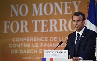 French President Emmanuel Macron gives a speech during the first day of a two-day conference in Paris, France, on combating the financing of terror groups, on April 26, 2018. (AFP/Eric Feferberg)