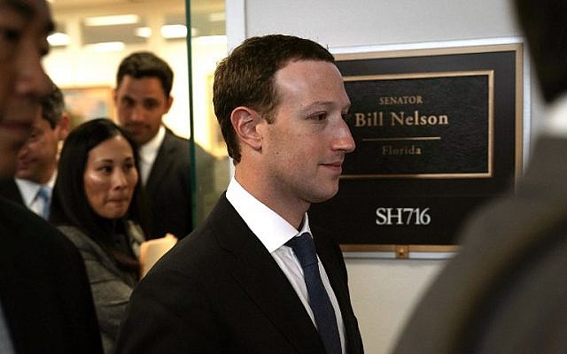 Facebook CEO Mark Zuckerberg (C) leaves after a meeting with US Sen. Bill Nelson (D-FL), ranking member of the Senate Committee on Commerce, Science, and Transportation, April 9, 2018, on Capitol Hill, in Washington, DC. (Alex Wong/Getty Images/AFP) Facebook CEO Mark Zuckerberg (C) leaves after a meeting with US Sen. Bill Nelson (D-FL), ranking member of the Senate Committee on Commerce, Science, and Transportation, April 9, 2018, on Capitol Hill, in Washington, DC. (Alex Wong/Getty Images/AFP)