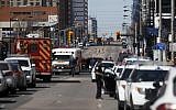 Law enforcement and first responders on scene at Yonge St. at Finch Ave. after a van plows into pedestrians April 23, 2018, in Toronto, Ontario, Canada (Cole Burston/Getty Images/AFP)