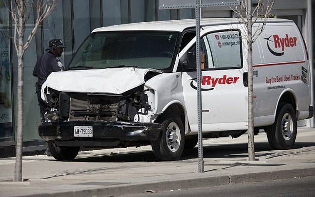 Police inspect a van suspected of being involved in a collision killing 10 people at Yonge St. and Finch Ave. on April 23, 2018, in Toronto, Canada. (Cole Burston/Getty Images/AFP) Police inspect a van suspected of being involved in a collision killing 10 people at Yonge St. and Finch Ave. on April 23, 2018, in Toronto, Canada. (Cole Burston/Getty Images/AFP)
