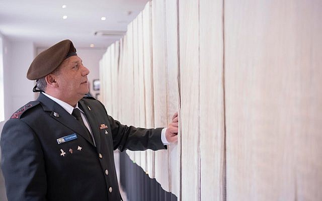 IDF chief Gadi Eisenkot looks through a printed list of all identified victims of the Holocaust at the Auschwitz concentration camp in Poland on April 12, 2018. (Israel Defense Forces) IDF chief Gadi Eisenkot looks through a printed list of all identified victims of the Holocaust at the Auschwitz concentration camp in Poland on April 12, 2018. (Israel Defense Forces)