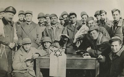 Rabbi Chaplain Robert Marcus, far left, with Jewish soldiers in 1944. (Tamara Green and Roberta Marcus Leiner/via JTA)