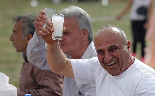 In this April 1, 2018 photo, Assyrian Christians raise their glasses of Arak as they celebrate Easter and the Assyrian New Year, or Akitu, in the village of Tal Arboush, northern Syria. They were snatching joy out of a sober surrounding. (AP Photo/Hussein Malla) In this April 1, 2018 photo, Assyrian Christians raise their glasses of Arak as they celebrate Easter and the Assyrian New Year, or Akitu, in the village of Tal Arboush, northern Syria. They were snatching joy out of a sober surrounding. (AP Photo/Hussein Malla)