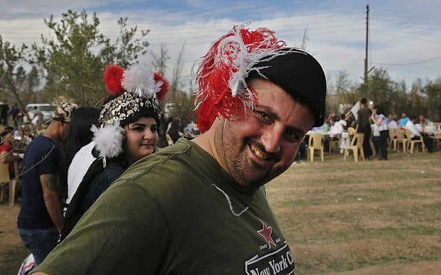 In this April 1, 2018 photo, Assyrian Christians wear traditional costumes and dance, as they celebrate Easter and the Assyrian New Year, or Akitu, in the village of Tal Arboush, northern Syria. (AP Photo/Hussein Malla) In this April 1, 2018 photo, Assyrian Christians wear traditional costumes and dance, as they celebrate Easter and the Assyrian New Year, or Akitu, in the village of Tal Arboush, northern Syria. (AP Photo/Hussein Malla)
