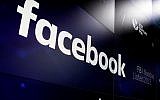 In this March 29, 2018 photo, the logo for Facebook appears on screens at the Nasdaq MarketSite in New York's Times Square. (AP Photo/Richard Drew, File)