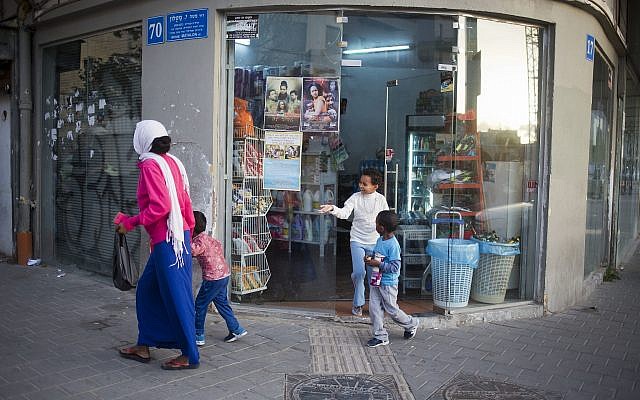 In this Tuesday, April 3, 2018 photo, A family of African migrants go shopping in southern Tel Aviv. (AP Photo/Ariel Schalit) In this Tuesday, April 3, 2018 photo, A family of African migrants go shopping in southern Tel Aviv. (AP Photo/Ariel Schalit)