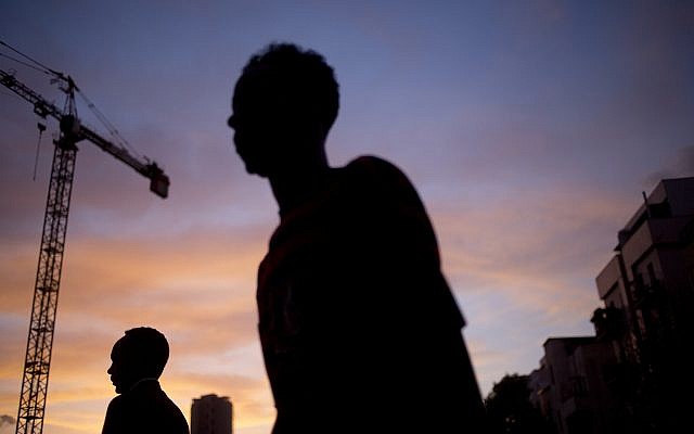 In this April 3, 2018, photo, African migrants cross a street in southern Tel Aviv. (AP Photo/Ariel Schalit) In this April 3, 2018, photo, African migrants cross a street in southern Tel Aviv. (AP Photo/Ariel Schalit)