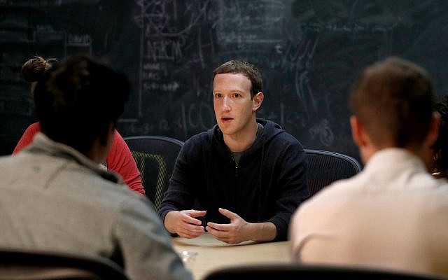 In this Nov. 9, 2017 photo, Facebook CEO Mark Zuckerberg meets with a group of entrepreneurs and innovators. (AP Photo/Jeff Roberson, File) In this Nov. 9, 2017 photo, Facebook CEO Mark Zuckerberg meets with a group of entrepreneurs and innovators. (AP Photo/Jeff Roberson, File)