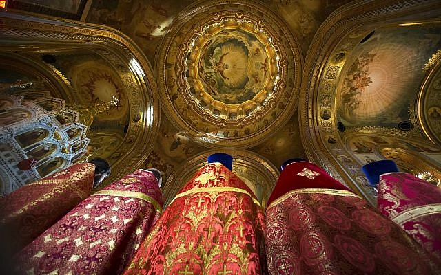 Russian Orthodox priests attend the Easter service in the Christ the Savior Cathedral in Moscow, Russia, April 8, 2018. (AP Photo/Alexander Zemlianichenko, Pool)