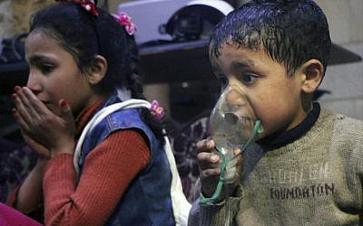 This image released Sunday, April 8, 2018 by the Syrian Civil Defense White Helmets, shows a child receiving oxygen through respirators following an alleged poison gas attack in the rebel-held town of Douma, near Damascus, Syria. Syrian rescuers and medics said the attack on Douma killed at least 40 people. (Syrian Civil Defense White Helmets via AP)