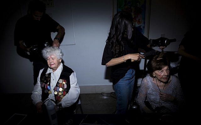 Holocaust survivors get their hair done during a Beauty Heroines event in Ramat Gan, Israel, Monday, April 9, 2018. (AP Photo/Oded Balilty)