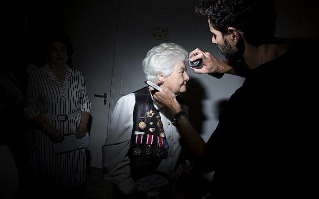 Soviet Jewish World War Two veteran Luba Nicolsky, 94, gets her hair done during a Beauty Heroines event in Ramat Gan, Israel, Monday, April 9, 2018. (AP Photo/Oded Balilty)