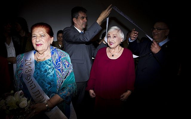 Holocaust survivors participate in a Beauty Heroines event in Ramat Gan, Israel, Monday, April 9, 2018. (AP Photo/Oded Balilty)