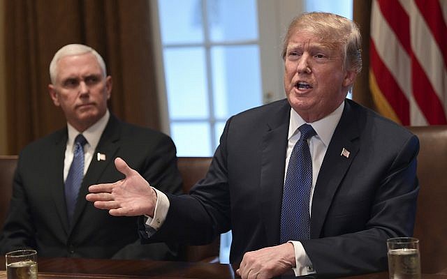 US President Donald Trump, right, sitting next to Vice President Mike Pence, speaks in the Cabinet Room of the White House in Washington, Monday, April 9, 2018, at the start of a meeting with military leaders. (AP Photo/Susan Walsh) US President Donald Trump, right, sitting next to Vice President Mike Pence, speaks in the Cabinet Room of the White House in Washington, Monday, April 9, 2018, at the start of a meeting with military leaders. (AP Photo/Susan Walsh)