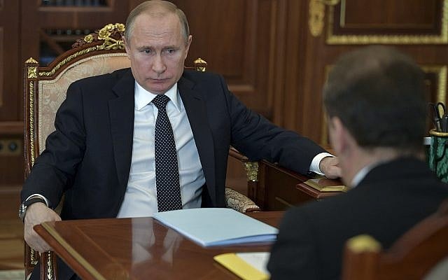 Russian President Vladimir Putin, left, listens to Russian Prime Minister Dmitry Medvedev, back to a camera, during their meeting in Moscow, Russia, Tuesday, April 10, 2018. (Alexei DruzhininSputnik, Kremlin Pool Photo via AP) Russian President Vladimir Putin, left, listens to Russian Prime Minister Dmitry Medvedev, back to a camera, during their meeting in Moscow, Russia, Tuesday, April 10, 2018. (Alexei DruzhininSputnik, Kremlin Pool Photo via AP)