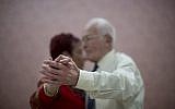 Holocaust survivors dance during a weekly social meeting at the Cafe Europa community and culture center in Ramat Gan, Israel, a day before Israel begins it annual Holocaust Memorial Day, Tuesday, April 10, 2018. (AP Photo/Oded Balilty)